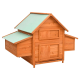 Holzhaustierhaus mit einem grünen, geneigten Dach, ausgestattet mit mehreren Zugangstüren und Seitenfächern für Haustiere.