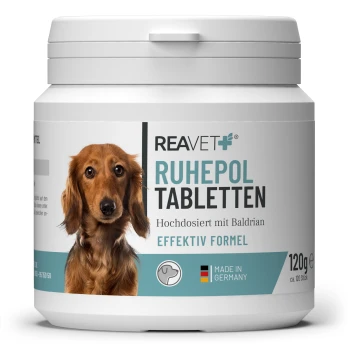 Behälter mit REAVET Ruhepol Tabletten für Hunde, 120g, mit einem Hundebild, mit Text, der auf die hohe Dosierung mit Baldrian hinweist.