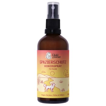 Braune Sprühflasche, beschriftet mit 'spazierschutz kokossspray' mit einem grünen Etikett, das behauptet, vor Zecken, Flöhen und Milben zu schützen.