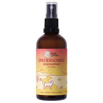 Braune Sprühflasche, beschriftet mit 'spazierschutz kokossspray' mit einem grünen Etikett, das behauptet, vor Zecken, Flöhen und Milben zu schützen.