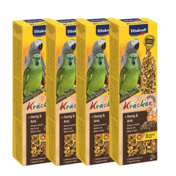 Four boxes of Vitakraft Kräcker bird treats featuring green and gray parrots on the front, labeled with "Honey & Anise" and nutritional benefits.