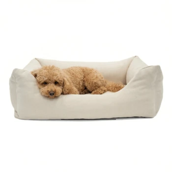 Graues Haustierbett mit erhöhten Rändern und einem weichen Innenraum, mit einem kleinen Etikett beschriftet "PAW."