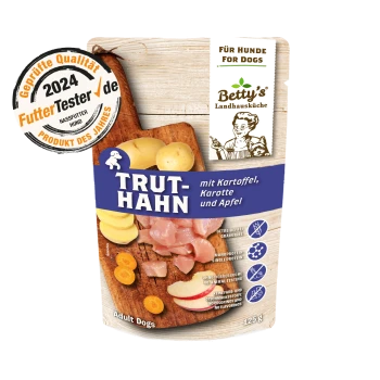 Hundefutterverpackung mit "TRUT-HAHN" mit Kartoffeln, Karotten und Äpfeln. Enthält die Etiketten "Getreidefrei" und "Einzelprotein". 125g.