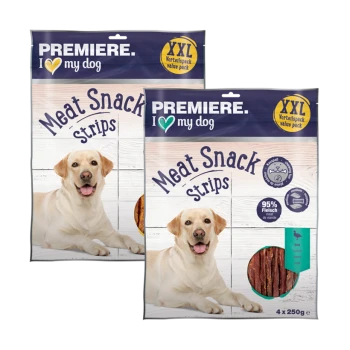 Zwei Packungen von "Premiere. Ich liebe meinen Hund" Fleischsnackstreifen, mit einem Hundebild, gekennzeichnet als Wertpackung mit 95% Fleischgehalt.
