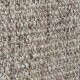 Close-up of a textured, woven natural fiber material in beige and brown tones, resembling a pet bed or mat.