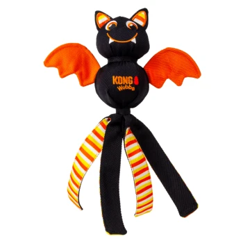 Black-orange KONG Wubba bat dog toy with smiling face, orange wings, striped dangling legs — text 'KONG wubba' on body.