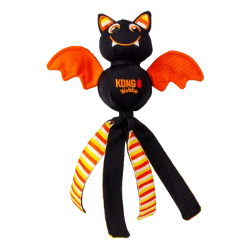 Black-orange KONG Wubba bat dog toy with smiling face, orange wings, striped dangling legs — text 'KONG wubba' on body.