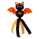 Black-orange KONG Wubba bat dog toy with smiling face, orange wings, striped dangling legs — text 'KONG wubba' on body.