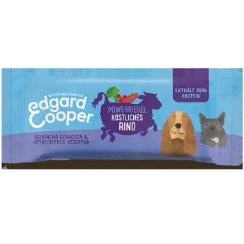 Edgard Cooper Power Bar für Hunde, mit einer blauen Verpackung mit Illustrationen eines Hundes und einer Katze, die "Köstliches Rind" und "Enthält 35% Protein" angibt.