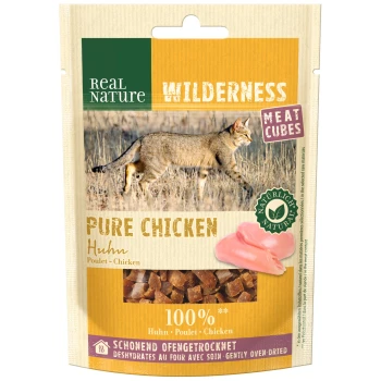 Real Nature Wilderness Pure Chicken pet treat packaging featuring meat cubes, with a wild cat image and text indicating 100% chicken.