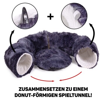 Dunkelgrauer Plüschhaustiertunnel in Donutform mit zwei Öffnungen und einem zentralen Polster. Text: "ZUSAMMENSETZEN ZU EINEM DONUT-FÖRMIGEN SPIELTUNNEL!"