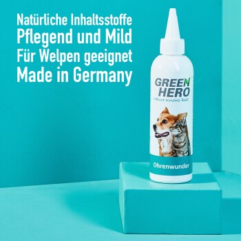 Flasche "GREEN HERO Ohrenwunder" Haustier-Ohrreiniger für Welpen, mit einem Hund und einer Katze auf dem Etikett und deutschem Text über natürliche Inhaltsstoffe.