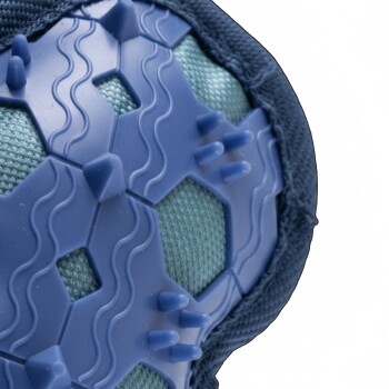 Close-up of a blue rubber pet paw protector with textured grips and fabric edges on a white background.