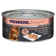 Une boîte de nourriture pour chats "Premiere" avec le visage d'un chat, étiquetée "Thon avec Crevettes" et "DANS SON PROPRE JUS".