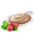 Nourriture pour animaux crémeuse dans un bol blanc, accompagnée de baies rouges et de feuilles vertes, présentant une friandise nutritive pour les animaux de compagnie.