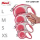 Image of four flexi dog leashes in varying sizes (L, M, S, XS) with a hand holding the medium-sized leash. Text reads "NEW COMFORT."