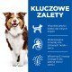 Pies z rozmytą twarzą obok niebieskiego panelu podkreślającego korzyści: białko dla mięśni, minerały dla nerek i witamina E dla skóry.