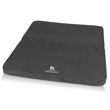 Ein schwarzes Hundebett mit einer strukturierten Oberfläche und dem Logo "KNUFFELWUFF", das prominent angezeigt wird.