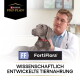 Tierarzt mit grauem Hund; zeigt Purina Pro Plan und FortiFlora (WISSENSCHAFTLICH ENTWICKELTE TIERNAHRUNG).