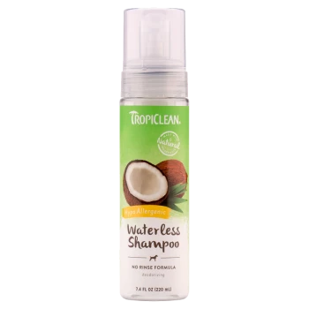 TropiClean Waterless Shampoo bottle, 7.4 fl oz, featuring a coconut graphic, labeled as hypoallergenic and deodorizing, no rinse formula.