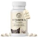 Vitamin B Komplex Ergänzung für Hunde und Katzen in einer weißen Flasche, mit einem Hund und einer Katze auf dem Etikett, mit 120 Tabletten abgebildet.