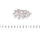 Kleine weiße runde Tabletten auf weißem Hintergrund über einem Zentimeterlineal mit Markierung 0–6 cm, beschriftet „cm“.