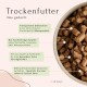 Trockenfutter in einer Schale mit deutschem Text, der transparente Zutaten, hohe Qualität, glutenfrei und Kaltpressverfahren hervorhebt.