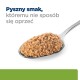 Srebrna łyżka trzymająca kopiec pasty pokarmowej dla zwierząt, z tekstem 'Pyszny smak, któremu nie sposób się oprzeć' nad nią.