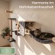 Katze klettert an einem wandmontierten Kratzbaum und eine andere Katze ruht in einer Hängematte; Text auf Deutsch über Stabilität und 35 kg Belastungsgrenze.