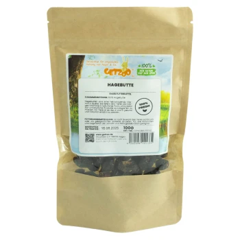 Hagebutte 100g Eine braune Papiertüte mit getrockneten Hagebutten, beschriftet mit "HAGEBUTTE," mit einem bunten Logo eines Kaninchens und dem Text, der 100% frische Zutaten angibt.