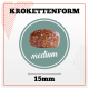 Image d'une croquette de nourriture pour animaux de compagnie de taille moyenne, étiquetée "KROKETTENFORM," avec un diamètre de 15 mm, affichée sur un fond clair.