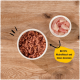 Haustierfutter in einer weißen Schüssel mit einer Beilage aus rohen Fleischstücken, mit dem Text: "Mit 70% Muskelfleisch und feinen Innereien."