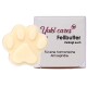 Yuki Cares Fellbutter, eine pfotenförmige Haustierbutter, neben ihrer Verpackung, mit Text auf Deutsch, der eine harmonische Atmosphäre fördert.