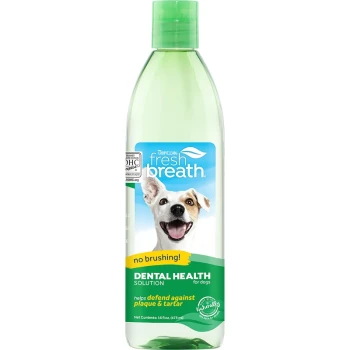 TropiClean Fresh Breath Dental Health Solution for dogs, featuring a smiling dog and text: "no brushing!" and "defends against plaque & tartar."