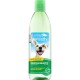 TropiClean Fresh Breath Dental Health Solution for dogs, featuring a smiling dog and text: "no brushing!" and "defends against plaque & tartar."