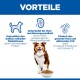 Braun-weißer Hund neben Trockenfutterschale unter der Überschrift 'VORTEILE'; deutscher Text: Vorteile für Muskeln, Herz/Nieren und Haut/Fell