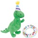 Green plush dinosaur toy wearing a striped party hat with a yellow pom-pom and a colorful ring toy with "LET'S PAWTY" text.