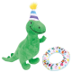 Green plush dinosaur toy wearing a striped party hat with a yellow pom-pom and a colorful ring toy with "LET'S PAWTY" text.