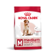 Royal Canin dog food bag for medium dogs (11-25 kg), labeled "adult 7+" with a golden retriever, promoting muscle mass and vitality.