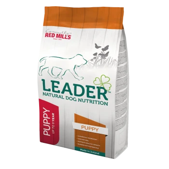A bag of Leader Natural Dog Nutrition puppy food with a dog silhouette and "PUPPY" and "Chicken No. 1 Ingredient" text. Made in Ireland.