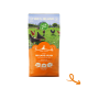 Hundefuttertüte mit der Aufschrift "Welpenempfindlichkeit", 100% Irland, 66% Fleisch, 34% Gemüse, mit Freilandhühnern auf einer grünen Wiese.