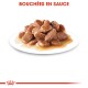 Bouchées en sauce, une assiette de morceaux de viande tendre dans une sauce riche, présentée sur une assiette blanche avec un logo de couronne rouge en bas.