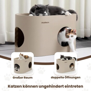 Beige PetRhein Katzenhöhle im sonnendurchfluteten Wohnzimmer; graue Katze schläft oben, eine dreifarbige Katze lugt von innen hervor, Sofa und Gartenblick im Hintergrund.
