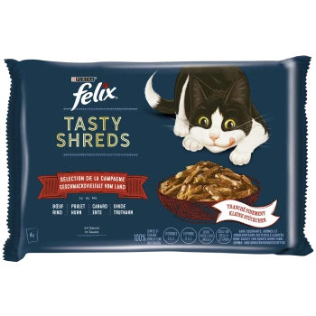 Eine Tüte Felix Tasty Shreds Katzenfutter mit einer verspielten schwarz-weißen Katze auf der Vorderseite, mit einer Schüssel mit zerrissenem Fleisch in Sauce.