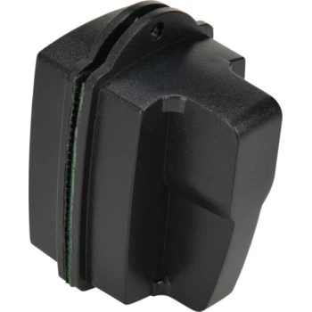 Schwarzes Haustierpflegewerkzeug-Aufsatz mit einer strukturierten Oberfläche und einem grünen Innenfutter, entworfen für die Verwendung mit Pflegegeräten.