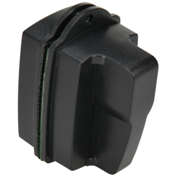 Accessoire de toilettage pour animaux de compagnie noir avec une surface texturée et un revêtement vert, conçu pour être utilisé avec des appareils de toilettage.