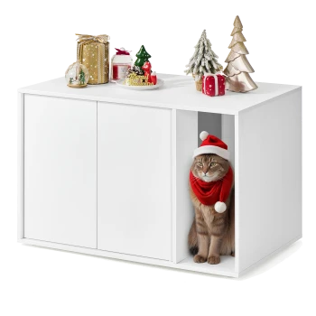 Eine festliche Katze mit einem Santa-Hut und einem roten Schal schaut aus einem weißen Schrank, umgeben von Feiertagsdekorationen oben.