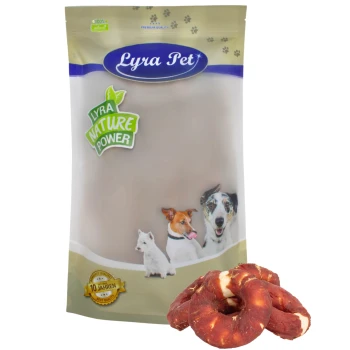 Kauringe mit Entenbruststreifen 1 kg Verpackung von Lyra Pet Hundeleckerlis mit einer beigen Tüte und einem grünen 'Lyra Nature Power'-Etikett sowie Bildern eines Hundes und einer Katze, mit Leckerlis davor.
