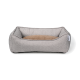 Lit pour animal de compagnie gris avec un coussin marron doux au centre, présentant des côtés surélevés pour le confort et le soutien.