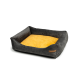 Graues und gelbes Haustierbett mit plüschigem Innenraum und erhöhten Seiten, mit einem kleinen braunen Etikett an der Seite.